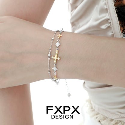 Gold cross silver bracelet featuring multiple crosses on a delicate chain for stylish layering