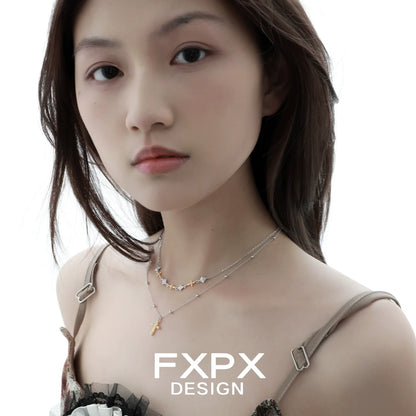 Stylish FXPX gold faith cross necklace worn layered for a trendy look