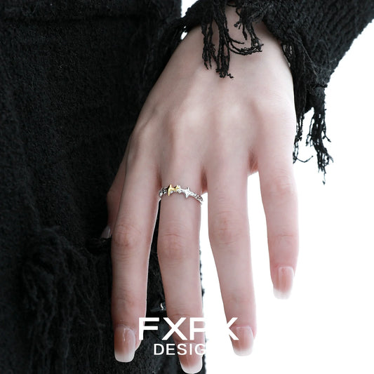 Stylish gold star ring by FXPX showcased on a model's hand with unique design