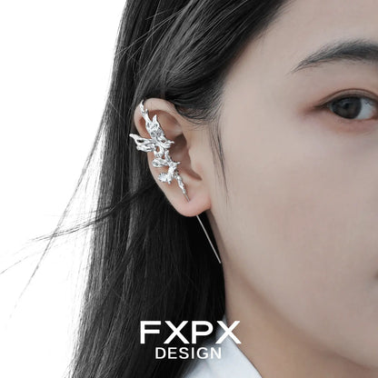 Silver Gothhalo jewelry butterfly agate earring worn on ear with detailed design by FXPX