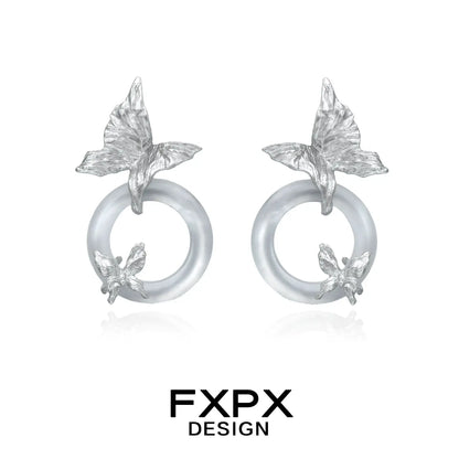 FXPX Gothhalo jewelry modern butterfly hoop earrings with silver butterfly details on translucent hoops