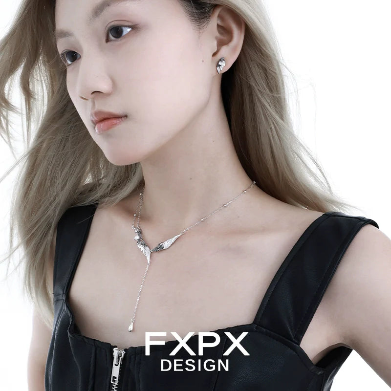 FXPX Gothic angel wing earrings in silver, designed for a stylish and edgy look.