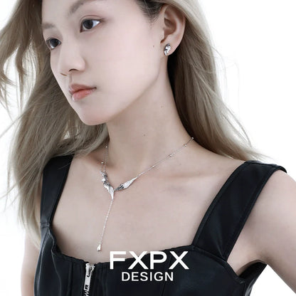 FXPX Gothic angel wing earrings in silver, designed for a stylish and edgy look.