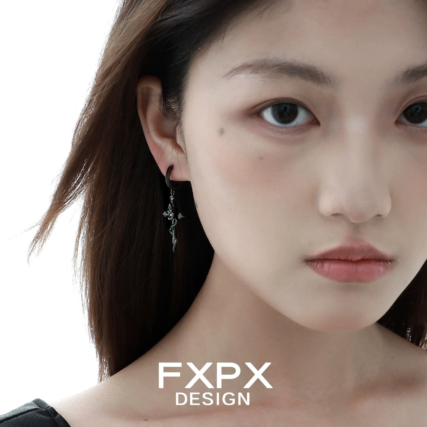 Gothic black viper snake earrings showcased on a model with a neutral expression