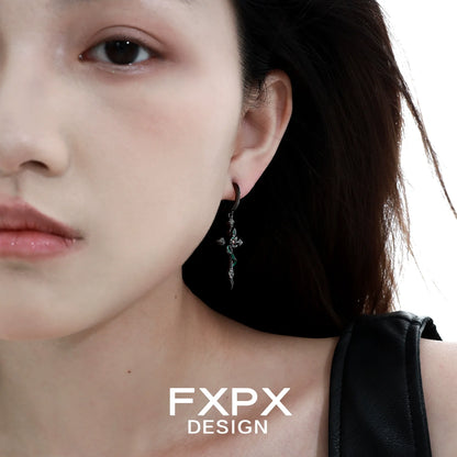 Gothic black viper snake earrings worn by model with long hair and edgy style