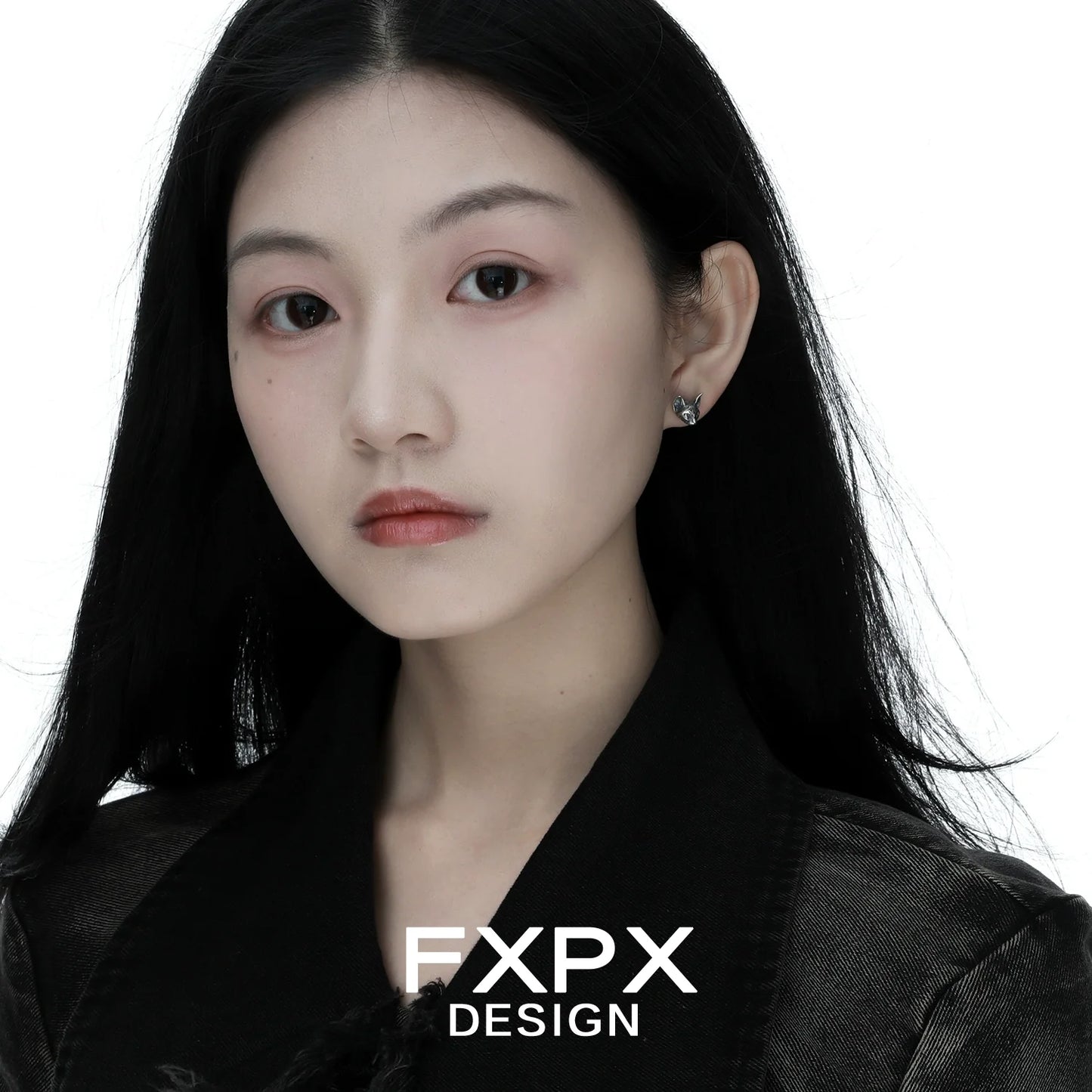 Elegant gothic cat earrings showcased on a model with long dark hair and a stylish black outfit