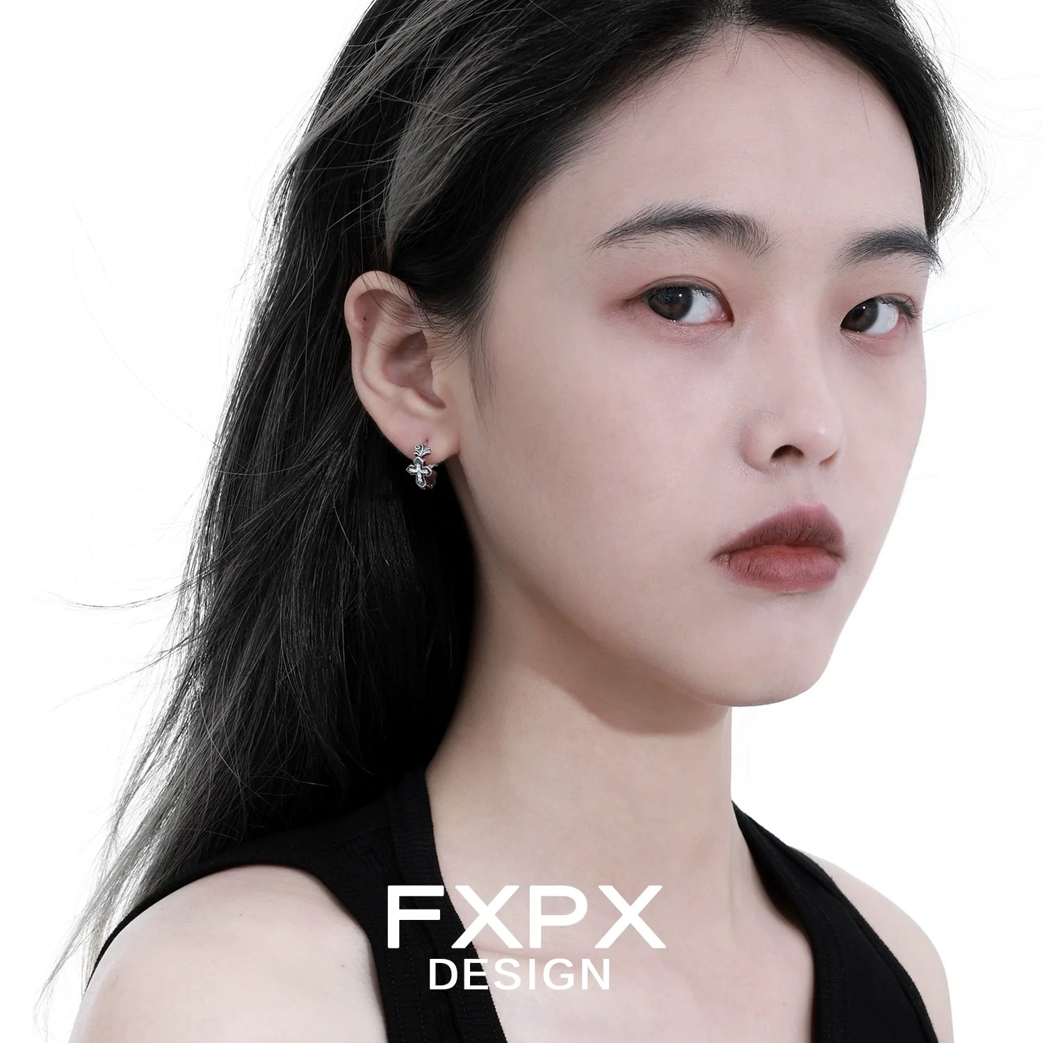 FXPX gothic cross earrings displayed on a model with long black hair for a stylish look