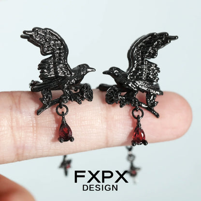 Stylish gothic crow ear cuffs with red gem accents for a unique accessory look