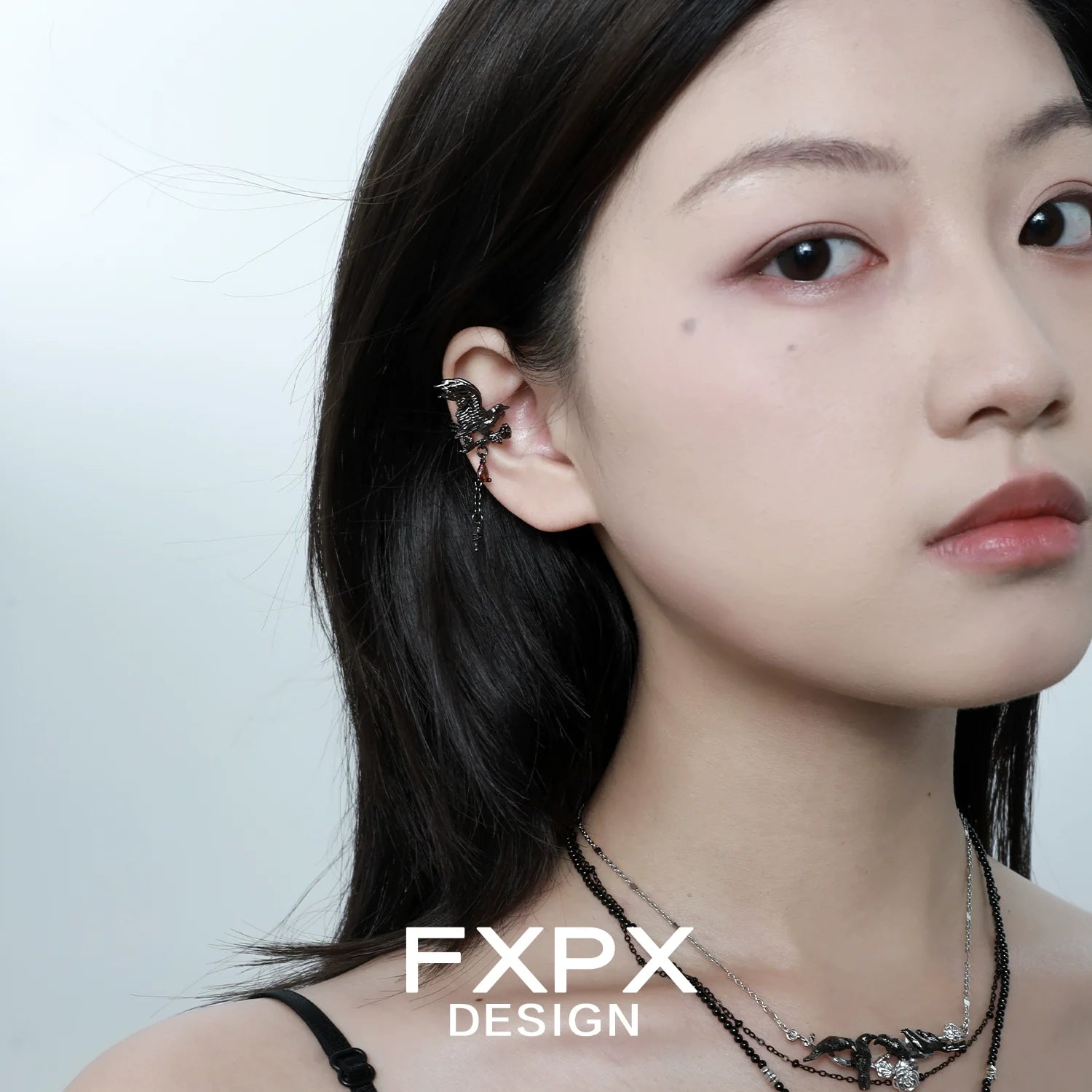 Stylish FXPX gothic crow ear cuffs worn by a model showcasing unique design and elegance