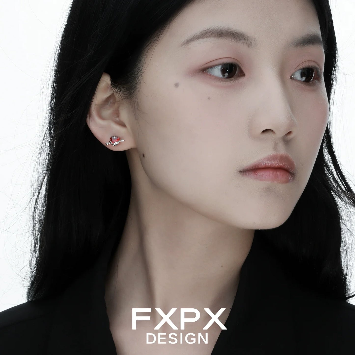 FXPX gothic heart earrings showcased on model, emphasizing a unique and edgy design