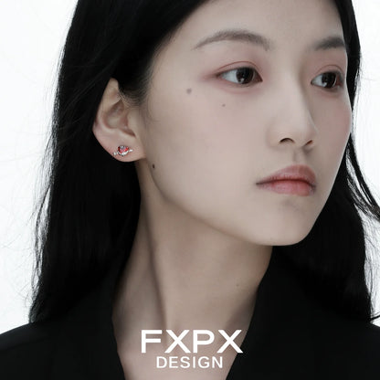FXPX gothic heart earrings showcased on model, emphasizing a unique and edgy design