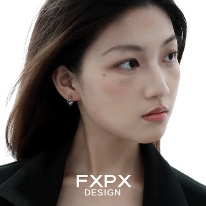 Stylish FXPX green snake earrings worn by a model showcasing unique design and elegance