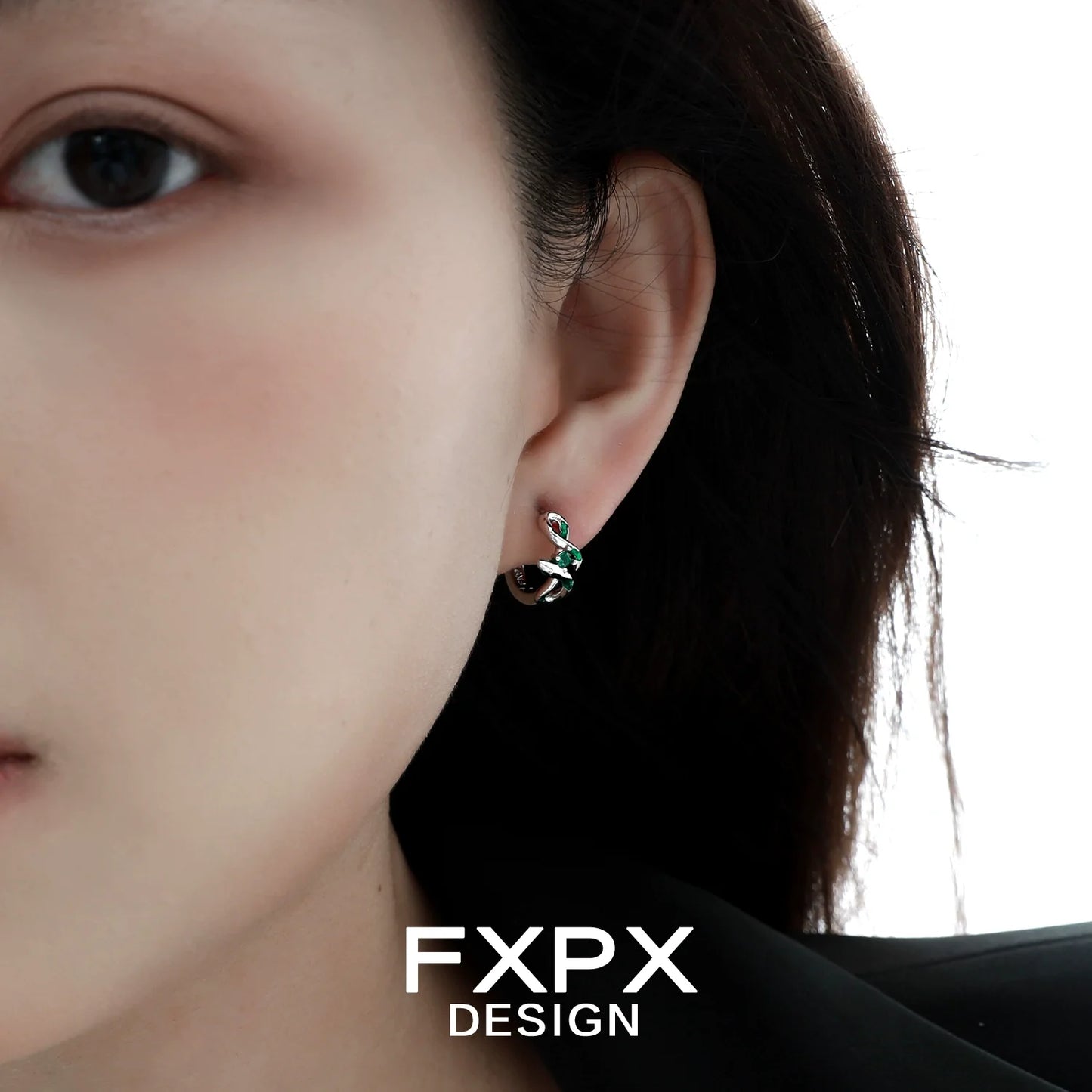 Unique FXPX green snake earrings in silver setting, perfect for adding a touch of style