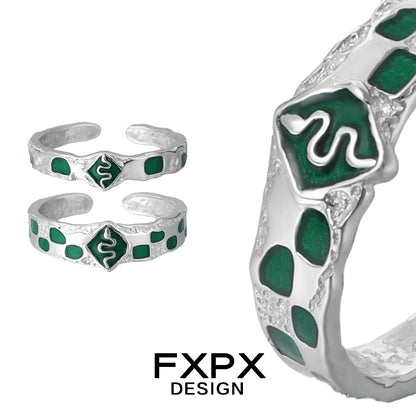 Unique FXPX green snake ring in silver with detailed snake design and emerald green accents