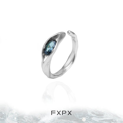 FXPX Iceland blue zircon ring with a unique wave design and a sparkling blue gemstone