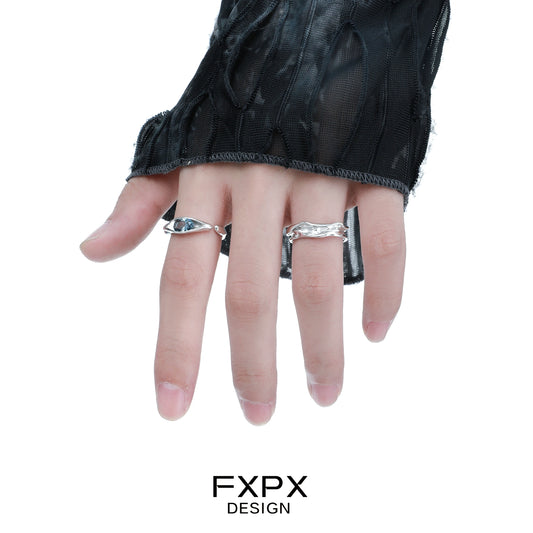 FXPX Iceland blue zircon ring worn on a hand with stylish black fabric sleeves