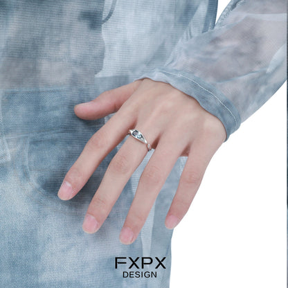Elegant FXPX Iceland blue zircon ring on a model's hand showcasing its sparkling design