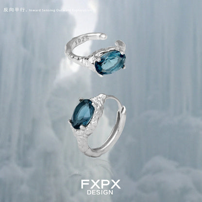 Elegant FXPX Iceland blue zircon stud earrings in sterling silver with intricate detailing
