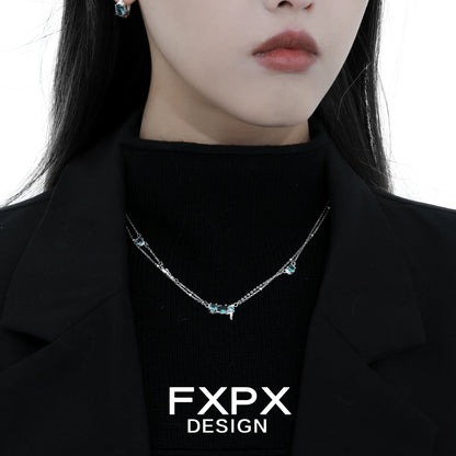 Elegant FXPX Icelandic blue zircon necklace on model showcasing its sparkling design