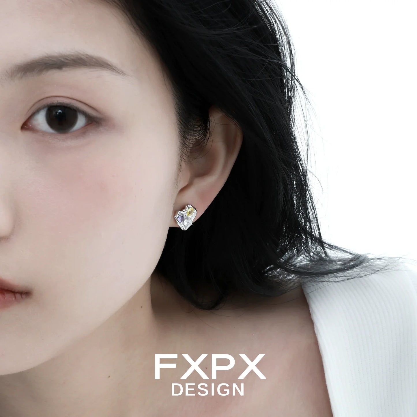 FXPX irregular dopamine earrings featuring a unique design and colorful accents worn by a model