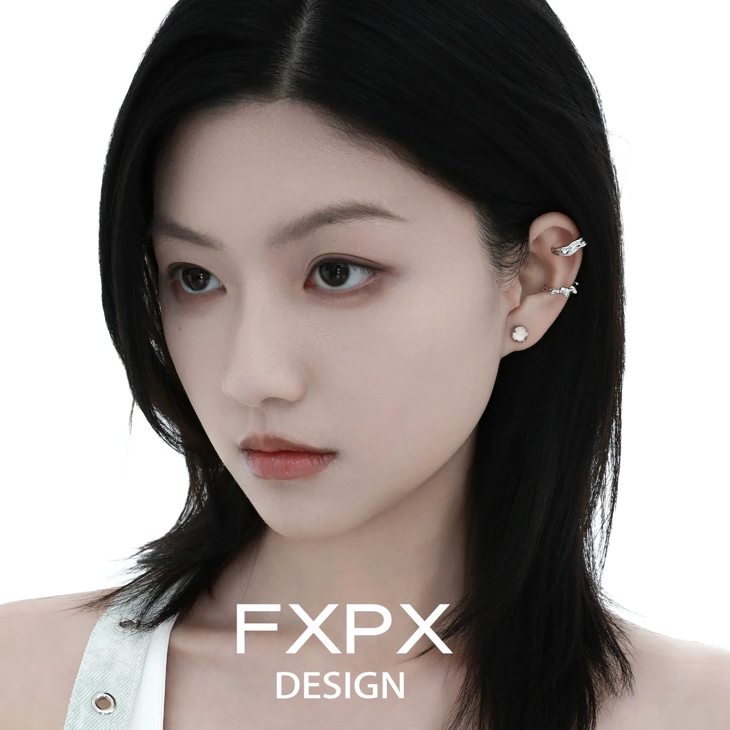 Irregular silver earrings designed by FXPX, showcasing a unique and modern style