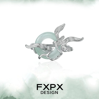 FXPX lake iris silver ring featuring an intricate floral design with a greenish stone