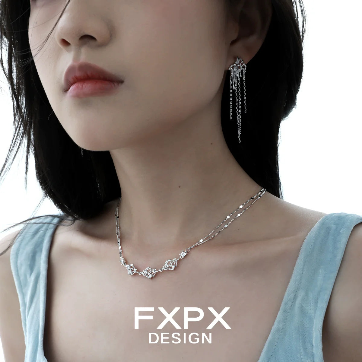 Layered silver gothic necklace showcased on a model with elegant styling