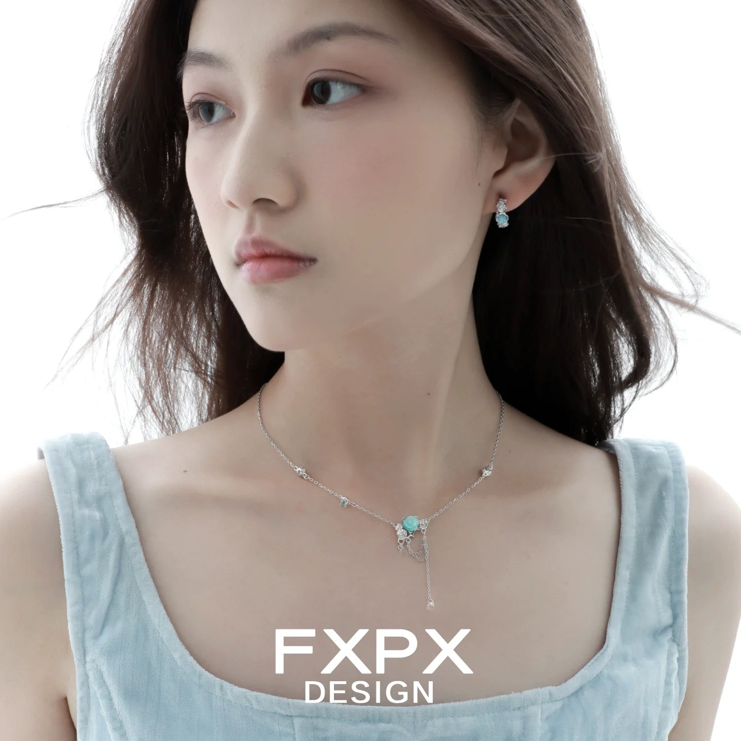 Elegant light blue rose pendant necklace paired with matching earrings for a stylish look