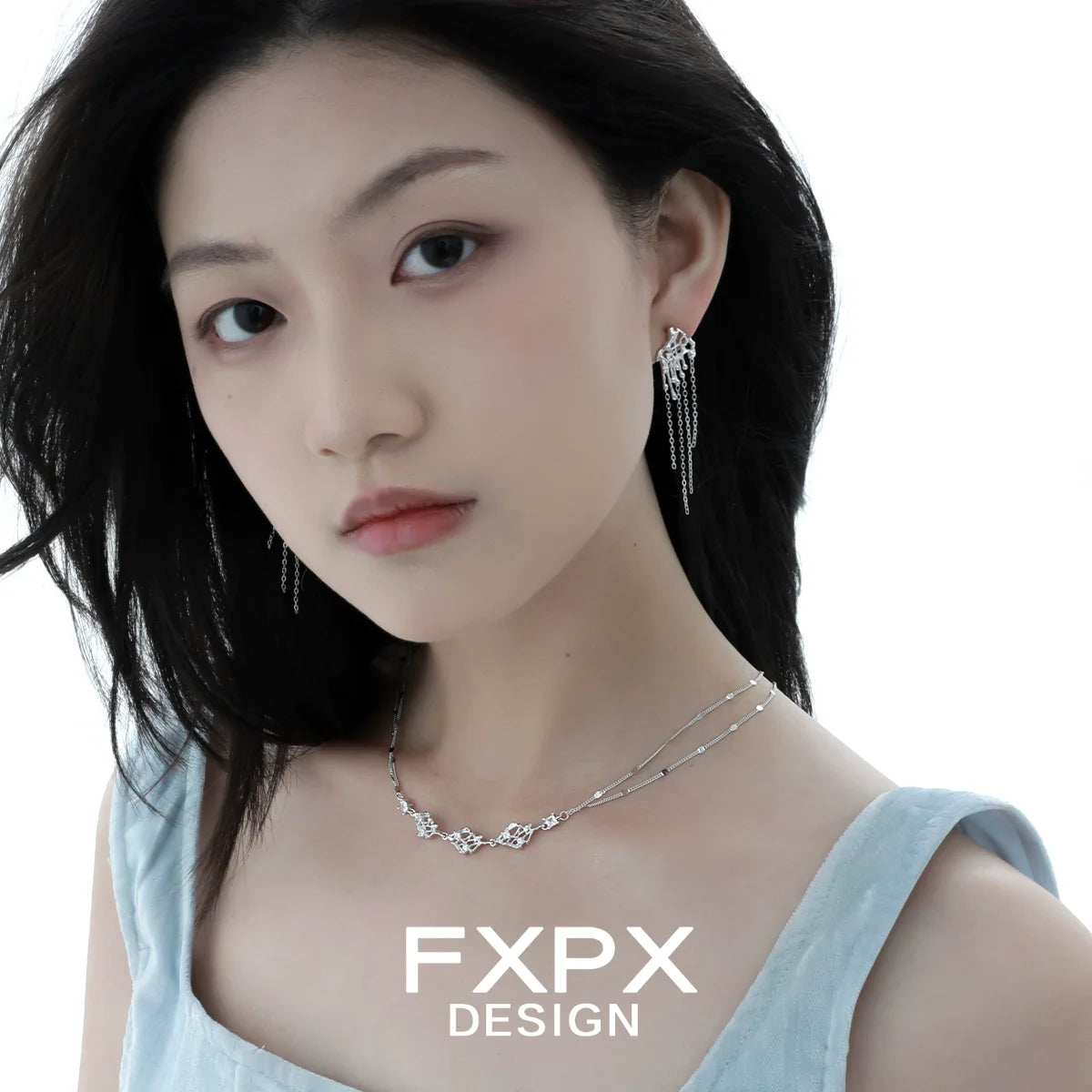 Stylish FXPX liquid metal tassel earrings elegantly showcased by a model