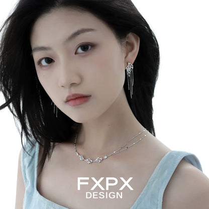 Stylish FXPX liquid metal tassel earrings elegantly showcased by a model
