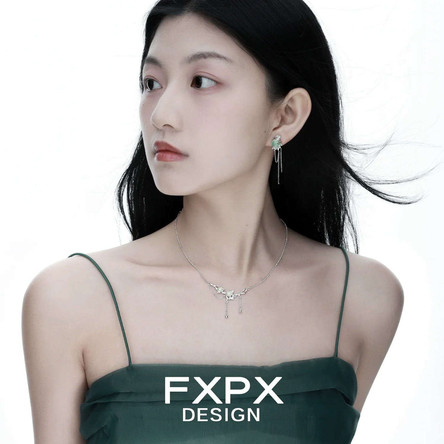 Elegant FXPX lotus pendant necklace displayed on a model with flowing hair and a stylish dress