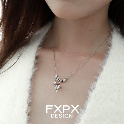 Stunning FXPX metal mushroom necklace with intricate design hanging on a delicate chain