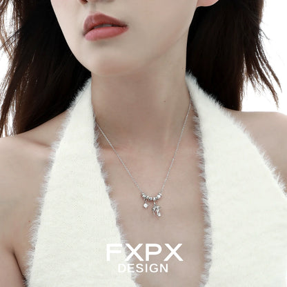 Close-up of a model wearing a metal mushroom necklace with delicate charm details for a trendy look