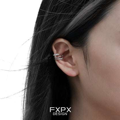 Stylish FXPX metal wave ear cuff in silver displayed on a model's ear