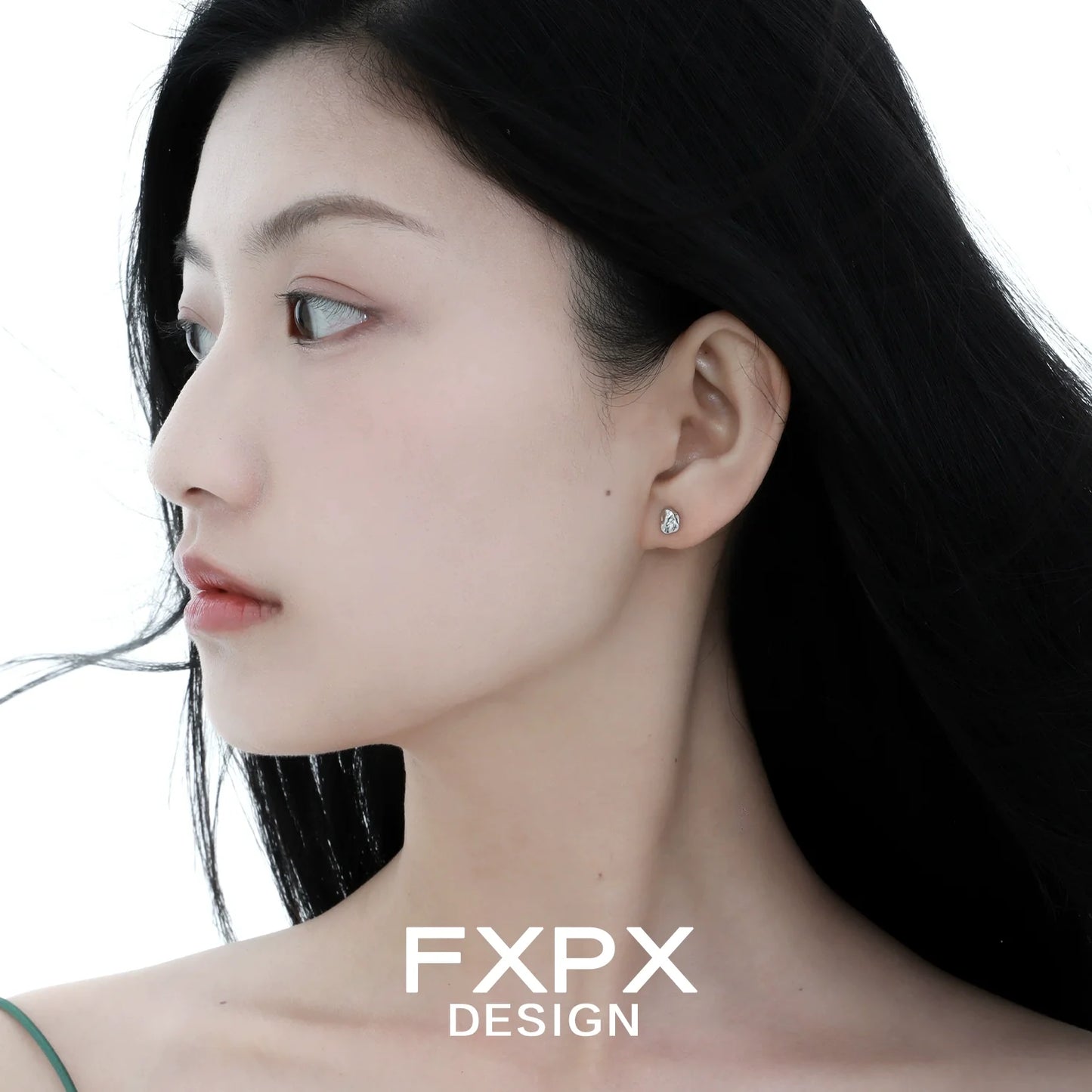Elegant FXPX meteorite stud earrings showcased on a model for a chic and modern look