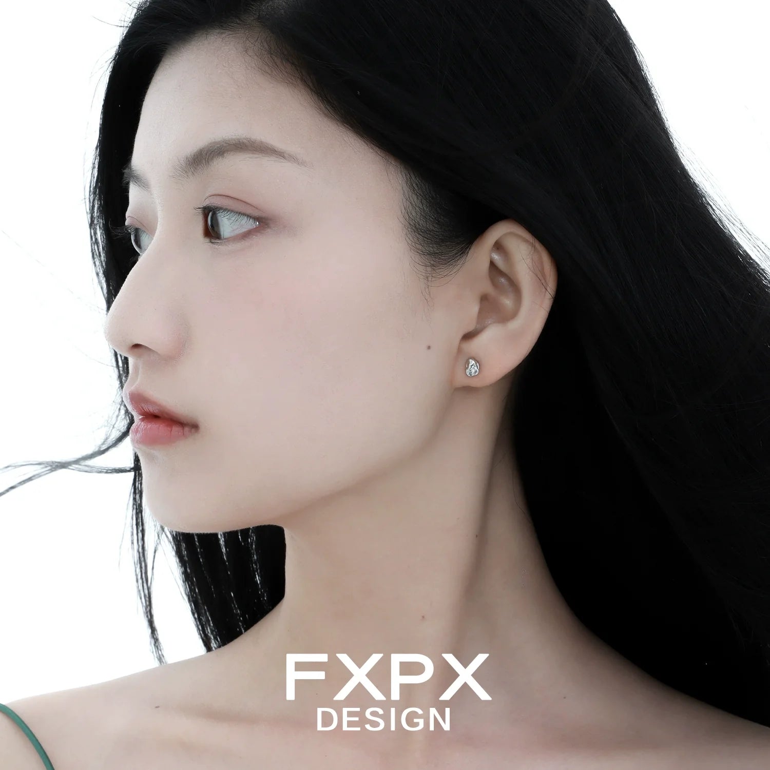 Elegant FXPX meteorite stud earrings showcased on a model for a chic and modern look