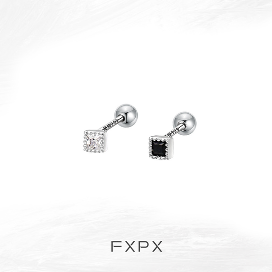 Minimalist black and white earrings featuring a sleek design with cubic shapes