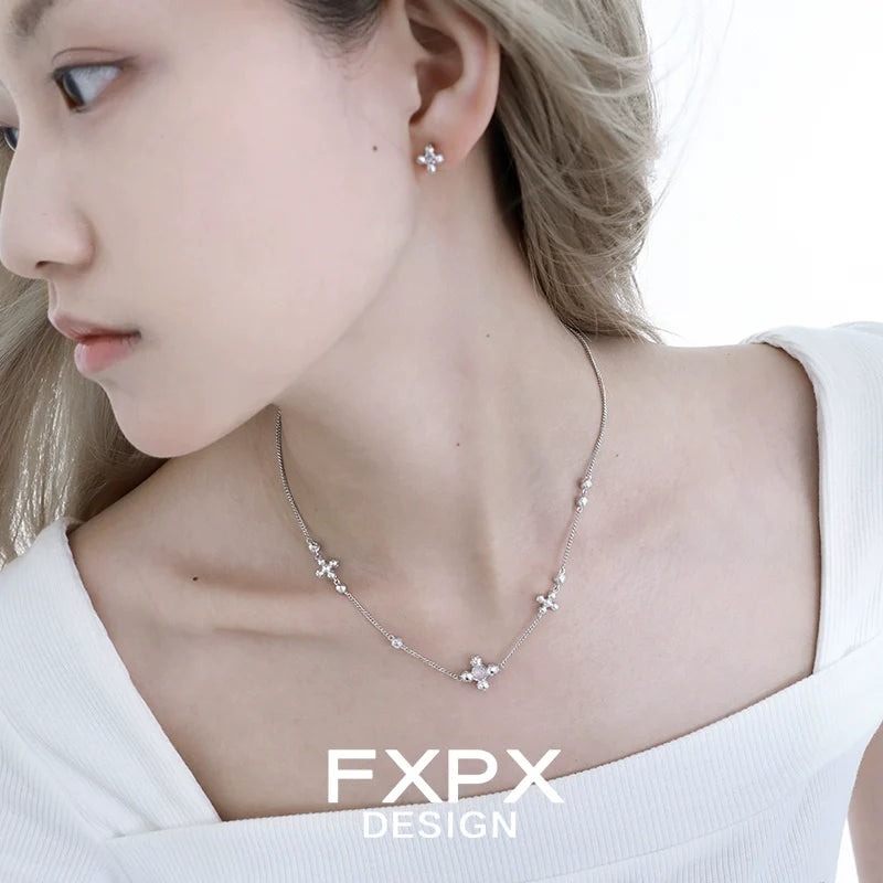 Elegant minimalist cross earrings in silver, perfect for versatile everyday wear
