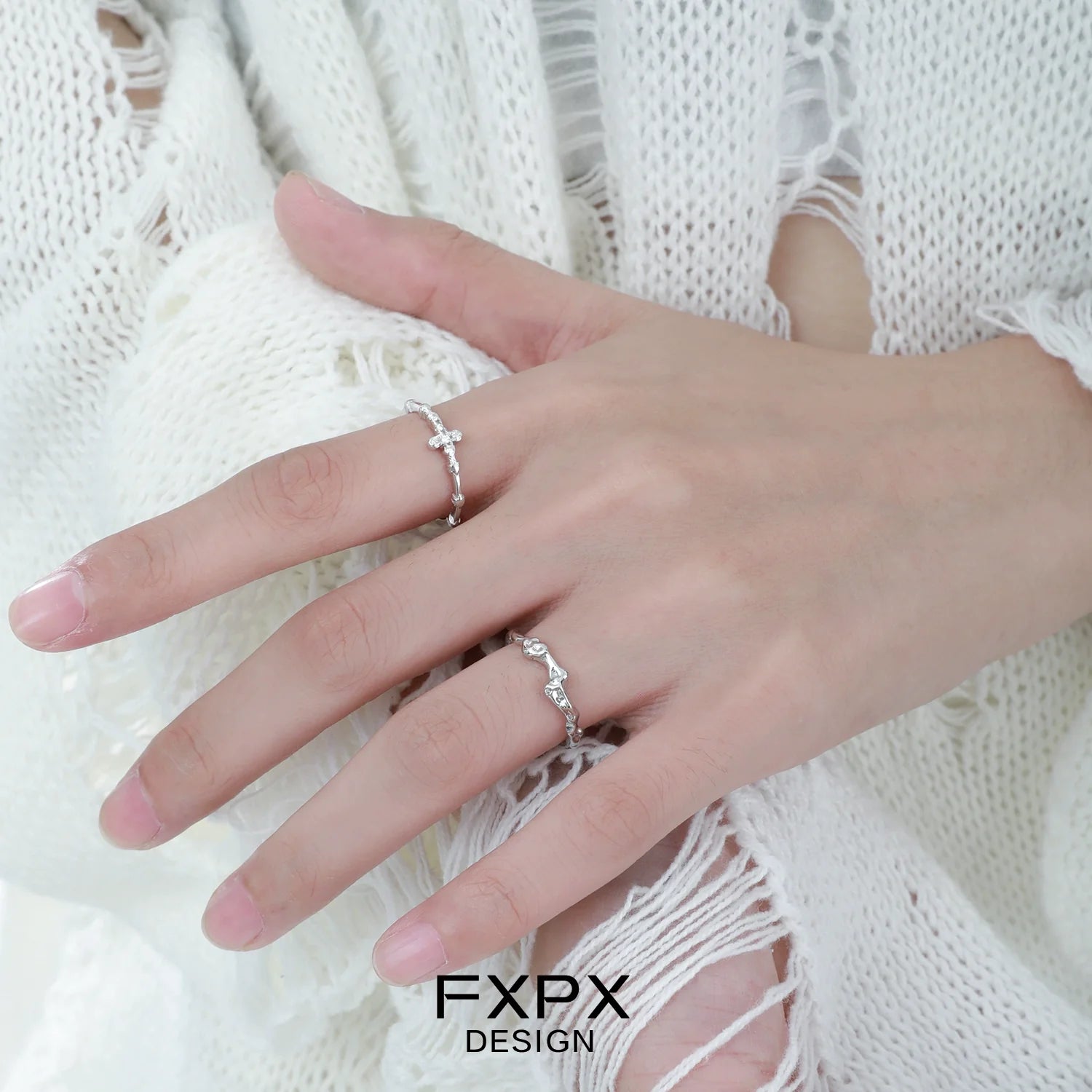 Stylish FXPX minimalist cross silver ring showcasing a delicate design on a hand