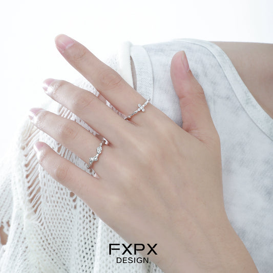 Elegant minimalist cross silver ring displayed on a hand for a chic look