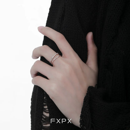 Elegant minimalist double layer ring showcased on a model's hand with a black sweater