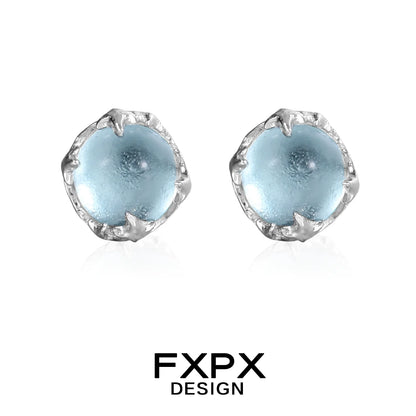 FXPX minimalist glacier earrings featuring light blue stones in a silver setting