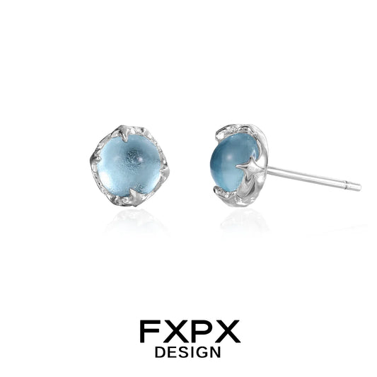 FXPX minimalist glacier earrings with blue gemstone in a sleek silver setting