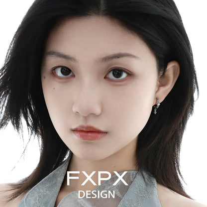 FXPX mint starburst stud earrings showcased on a model with long dark hair