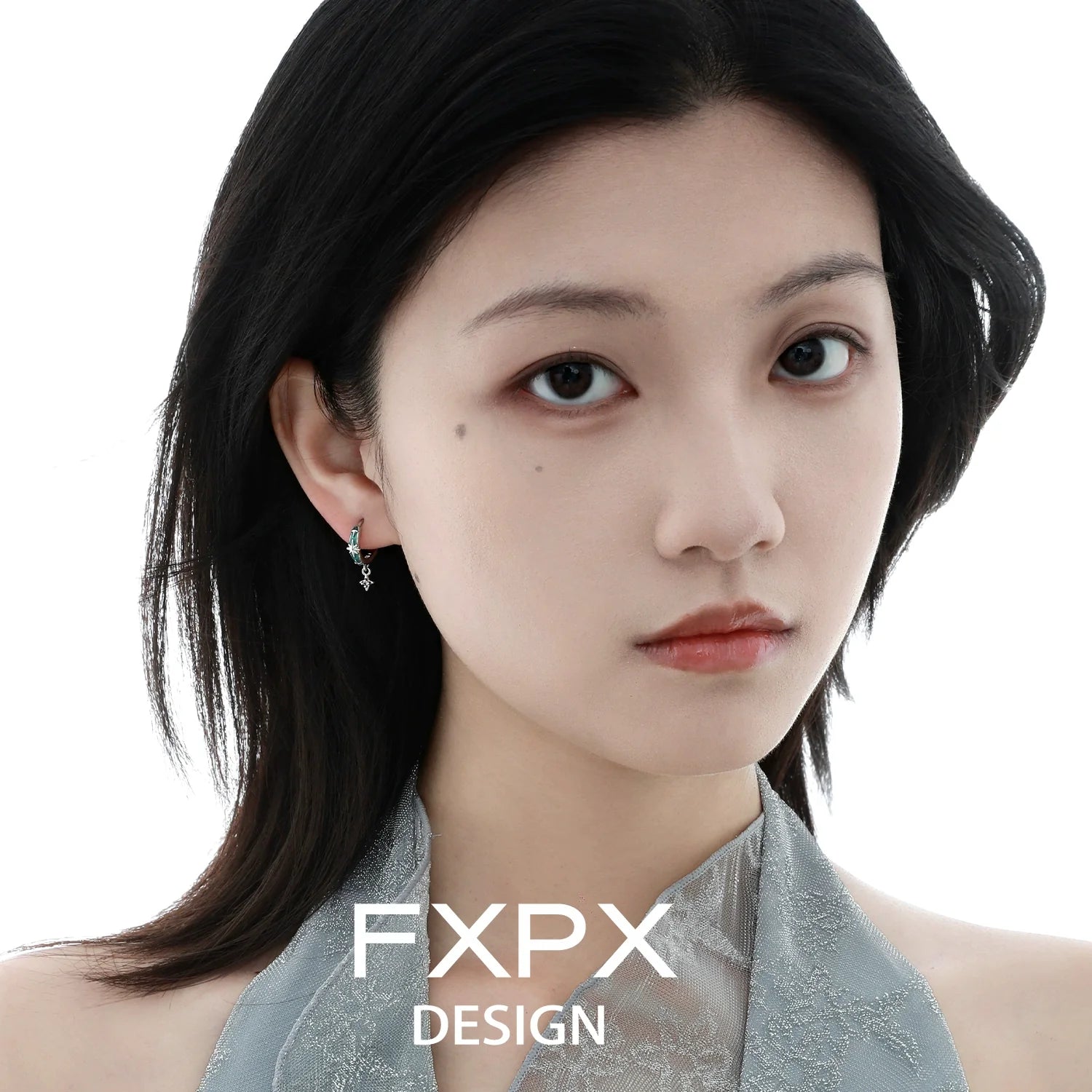 FXPX mint starburst stud earrings showcased on model with sleek hairstyle and elegant attire