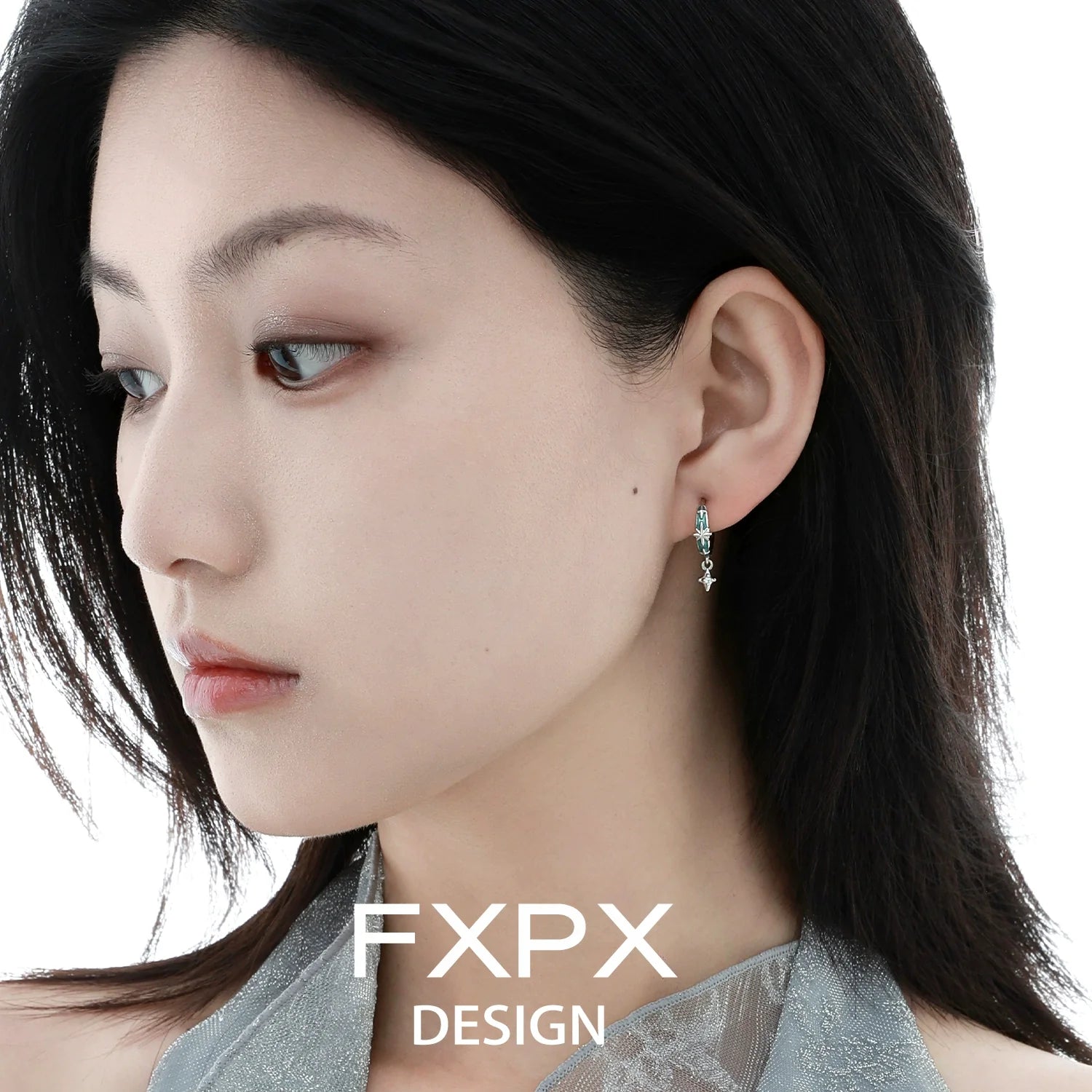 Mint starburst stud earrings featured on a model for a stylish look