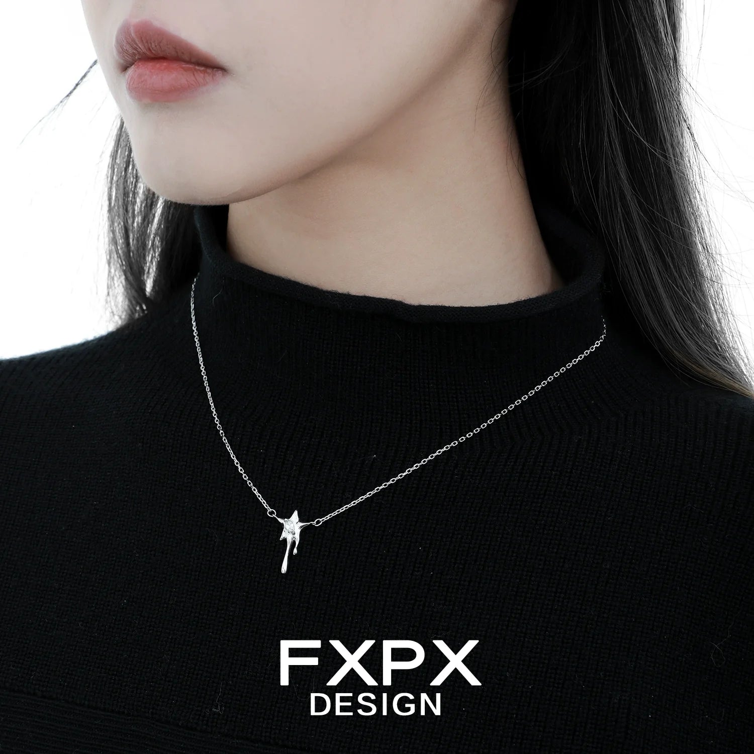 Moon star silver necklace by FXPX displayed elegantly on a model wearing a black top