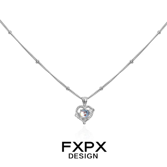 FXPX moonstone heart pendant necklace with a delicate silver chain and sparkling details