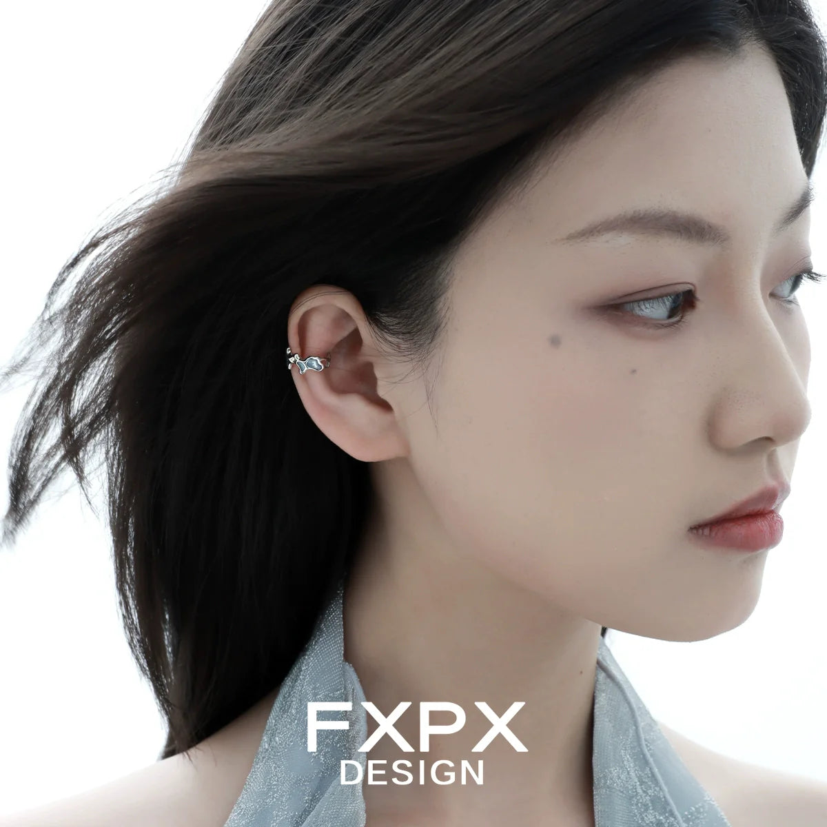 FXPX Mystic Island ear cuff worn elegantly on a model's ear for a stylish look
