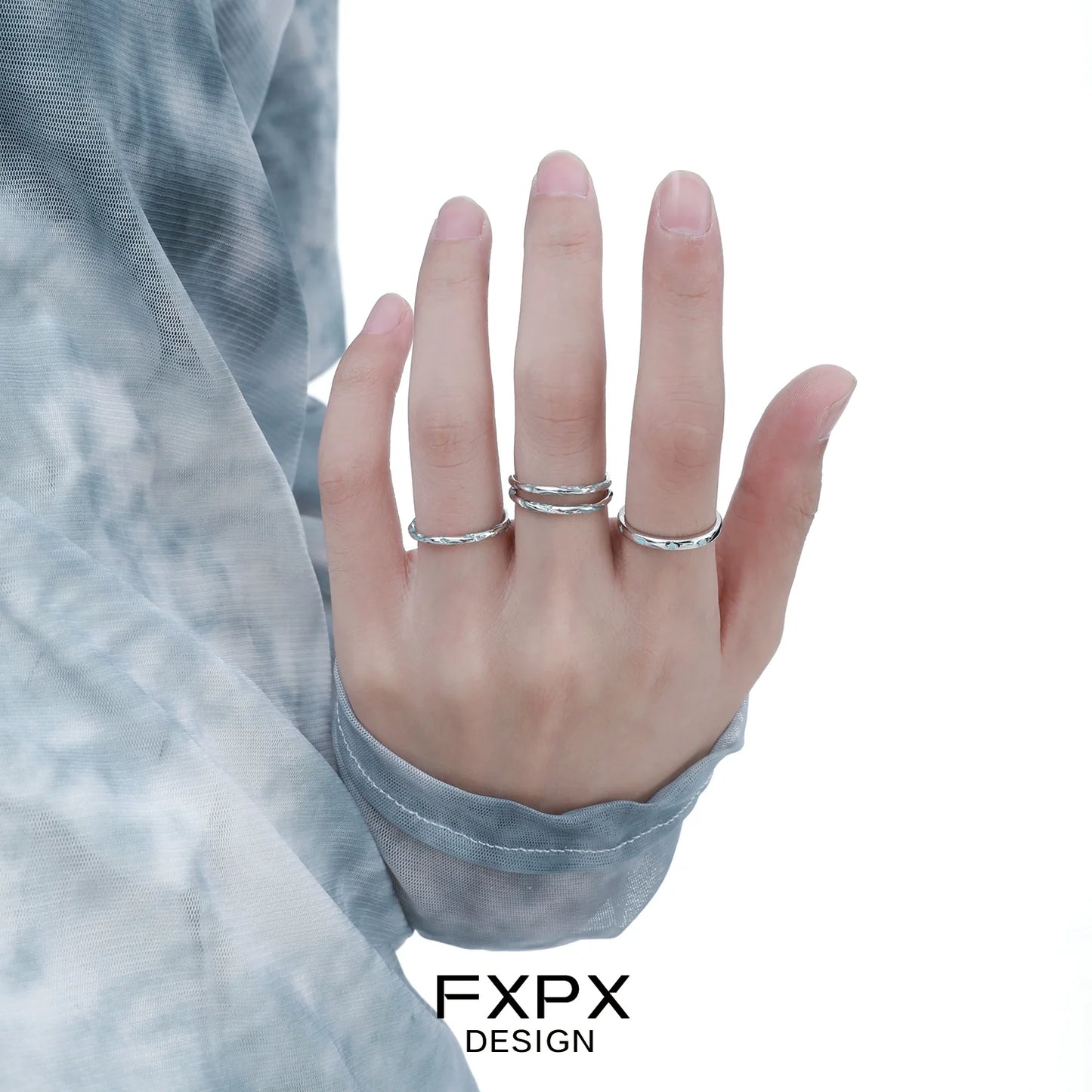 Stylish FXPX Ocean Breeze Ring set worn on hand with elegant silver design